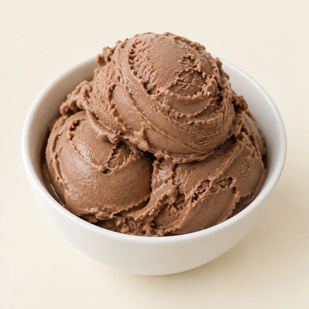 Homemade Fairlife chocolate ice cream in a white bowl